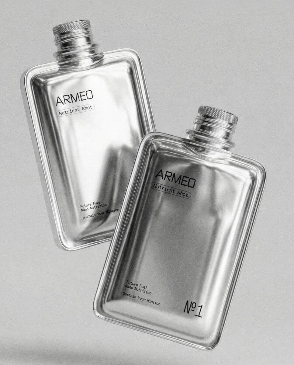 Two clear fragrance bottles on a light gray background